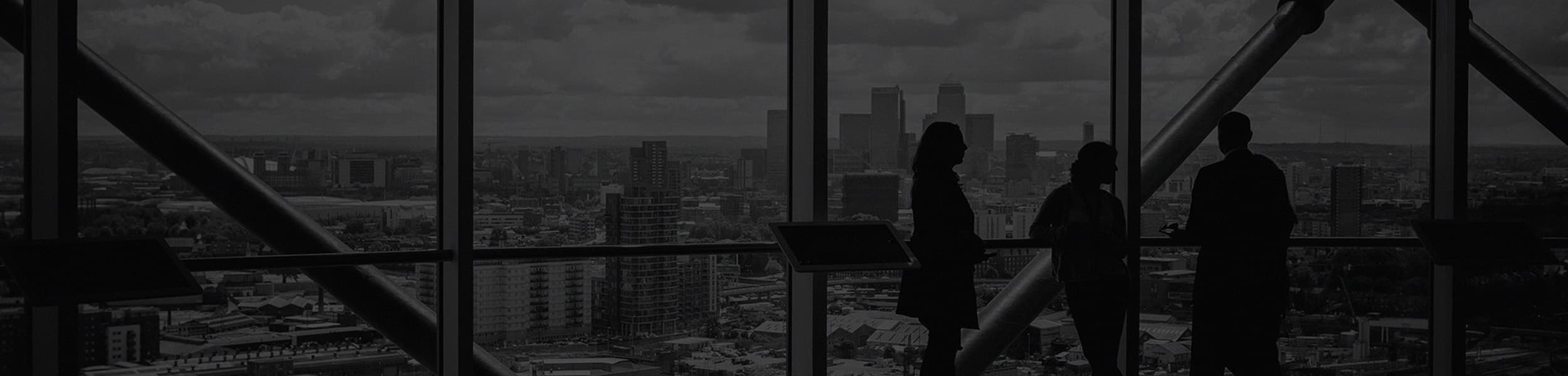 View overlooking a city through the windows of a large building.